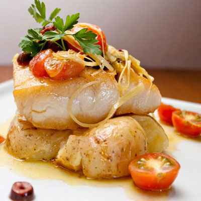 fish dish with tomatoes and olives